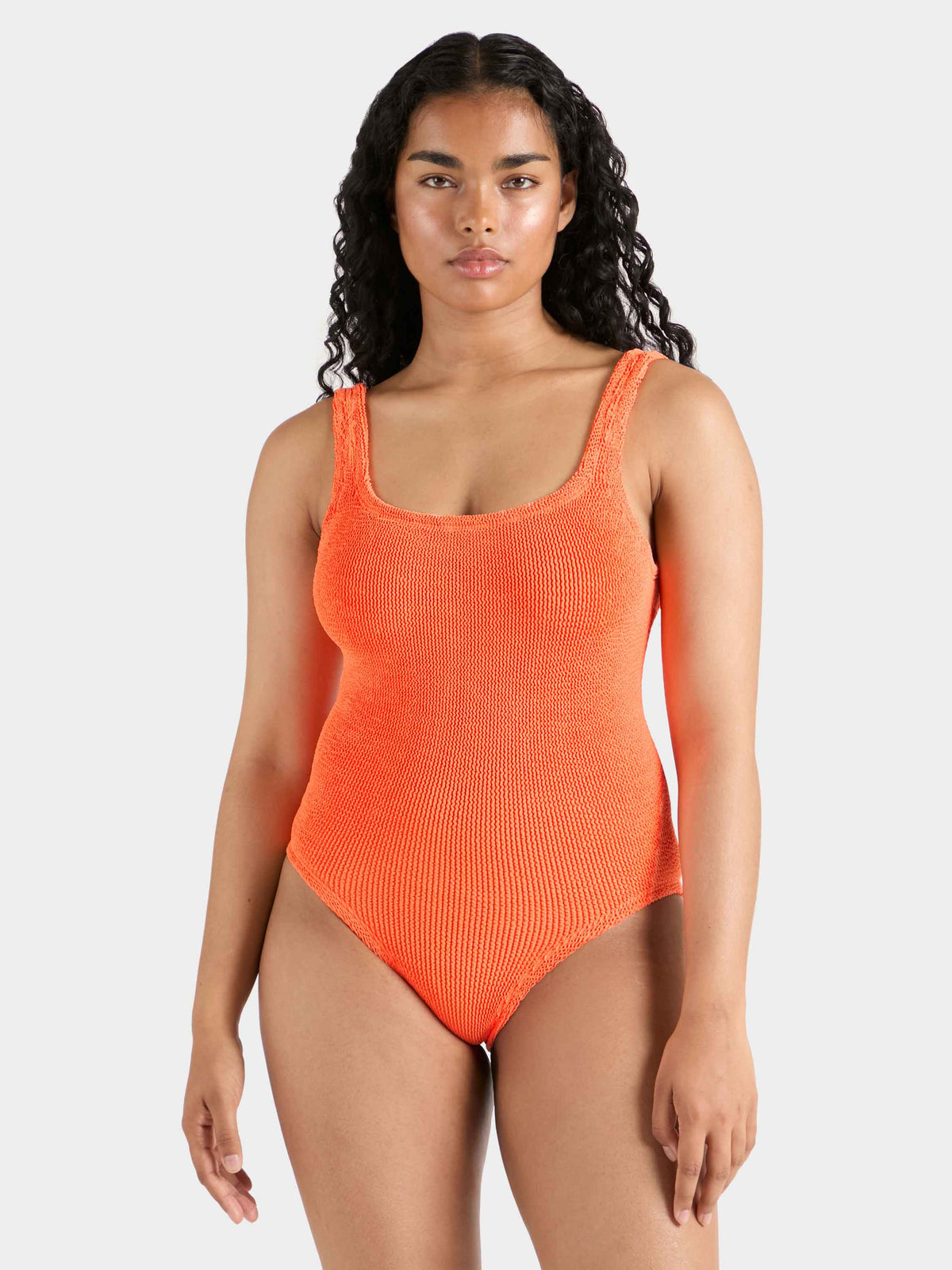 Model wearing Orange coverage square neck swimsuit