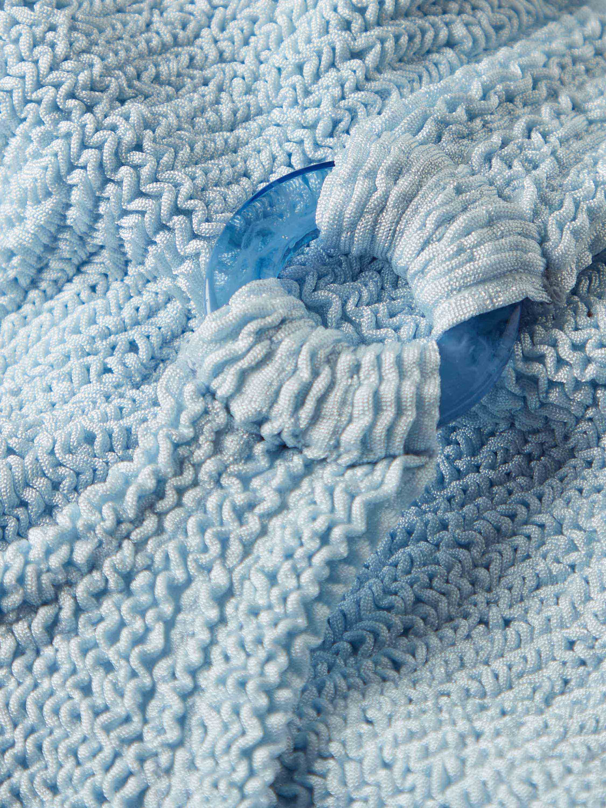 Close up of fabric and ring of Kids Domino Swimsuit (3-6 years) in Metallic Iced Blue