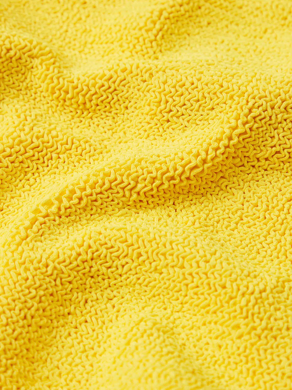 Close up fabric detail of the Sunflower Kids classic swimsuit 
