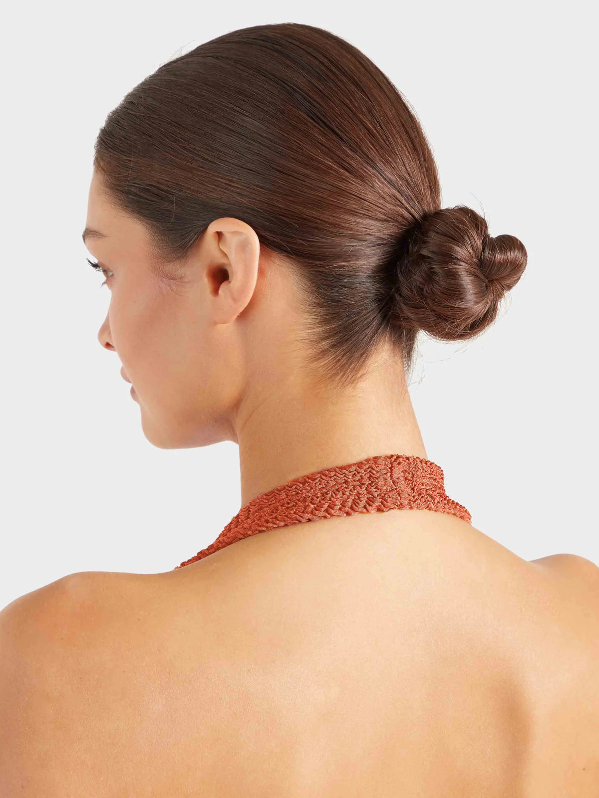 Close up of the orange halterneck swimsuit  strap