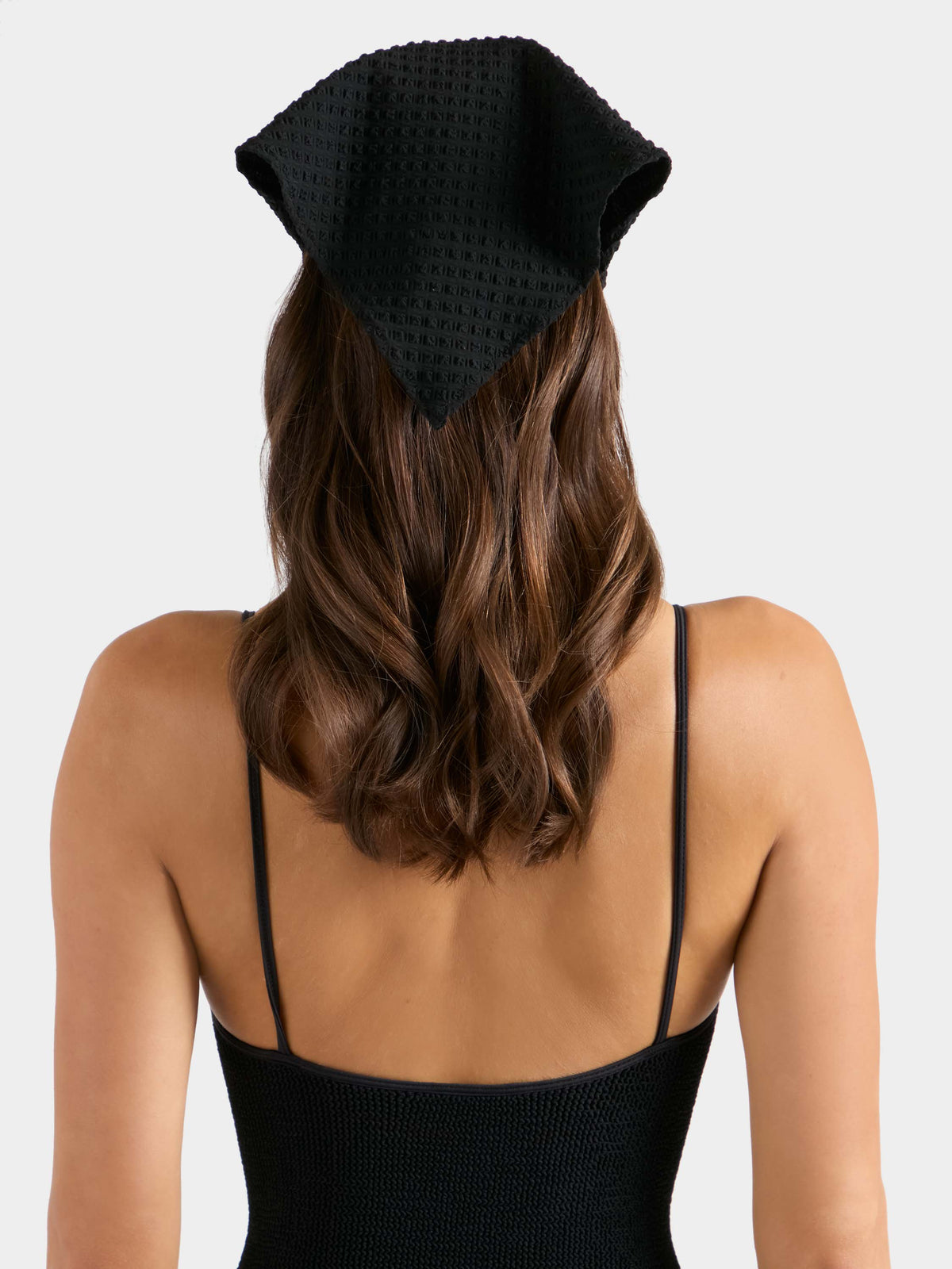 Back of model wearing Black Seersucker Sofia headscarf 