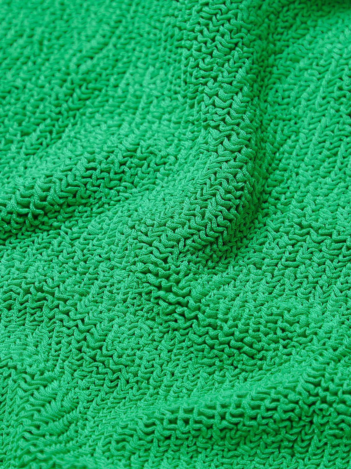 Close up of emerald Alicia bikini fabric 